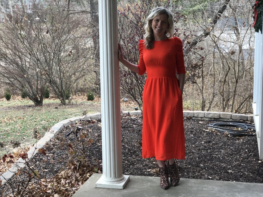 top 3 festive holiday outfits featured by top Missouri fashion blogger, Emmy Lou Styles: image of a blonde woman wearing an H&M red dress and leopard booties