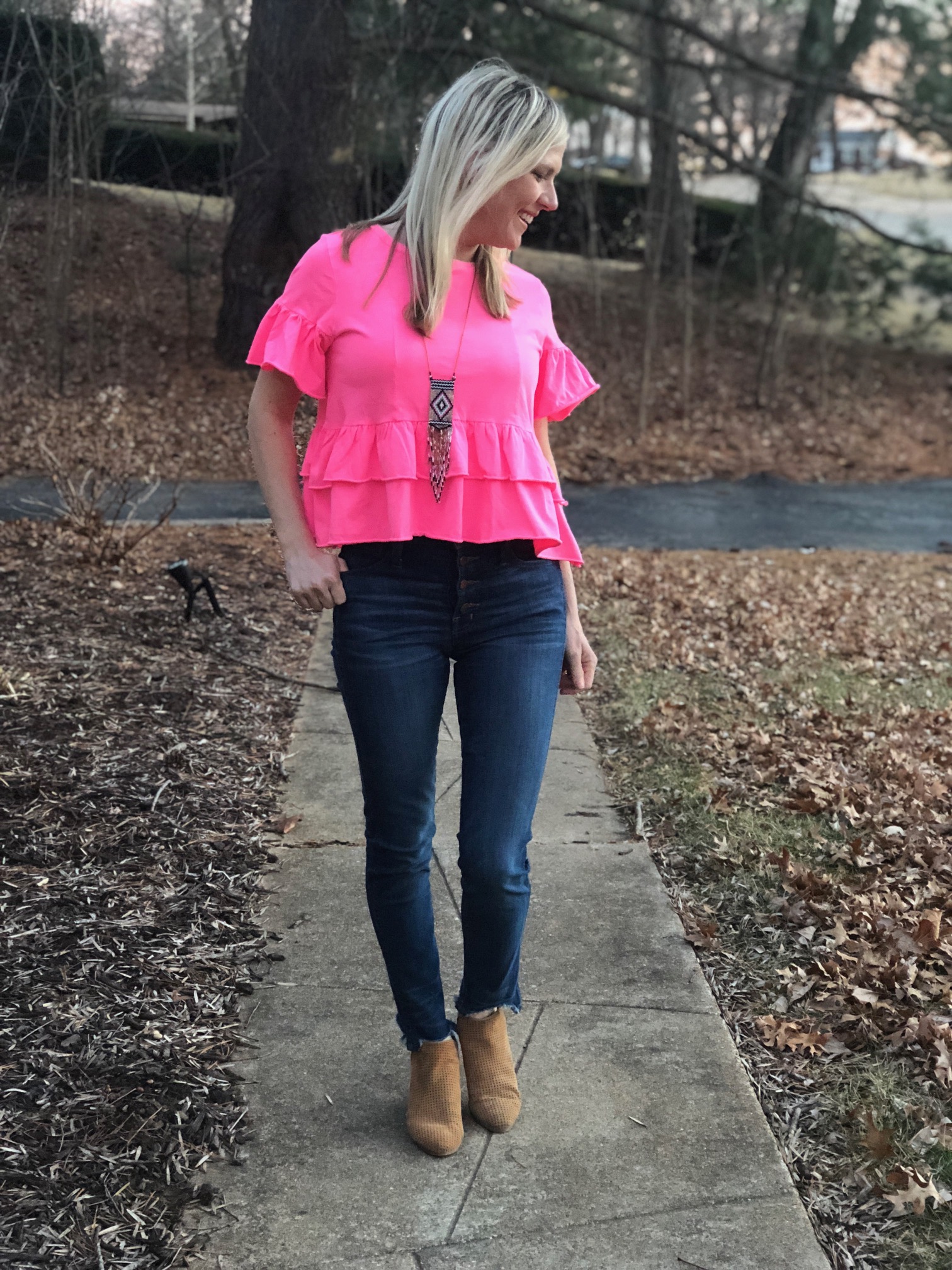 Nordstrom Try on Session featured by top Missouri fashion blogger, Emmy Lou Style: image of a woman wearing a peplum ruffle sleeve top