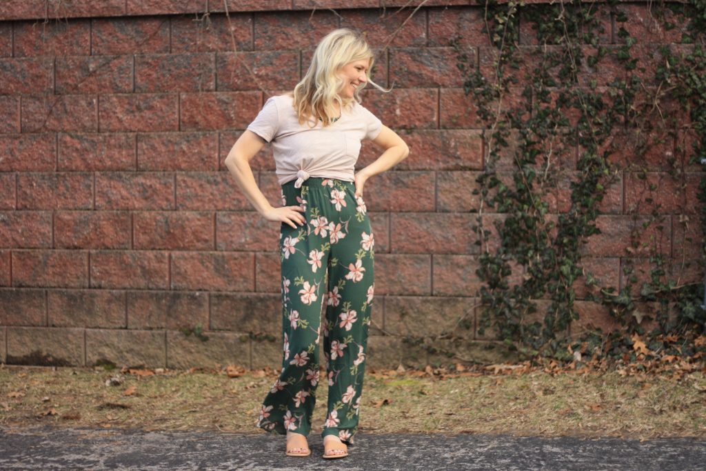 women's jumpsuit with a t-shirt over it | 3 Jumpsuit styling tips featured by top US fashion blogger, Emmy Lou Styles: image of a blonde woman wearing a floral off the shoulder jumpsuit and a plain cotton tee