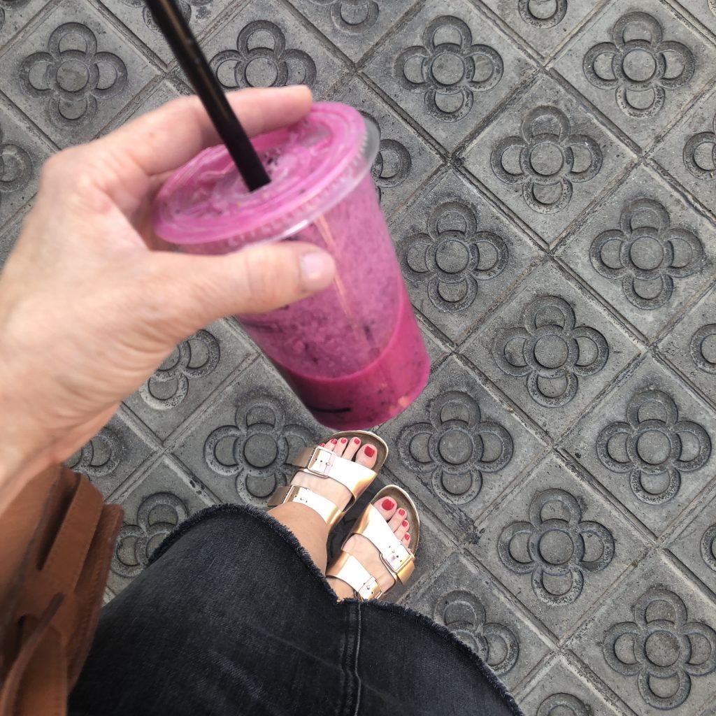 TOP 10 THINGS TO DO IN BARCELONA featured by top Missouri travel blogger, Emmy Lou Styles: Visit La Boqueria Food Market in Barcelona and try a dragonfruit smoothie.