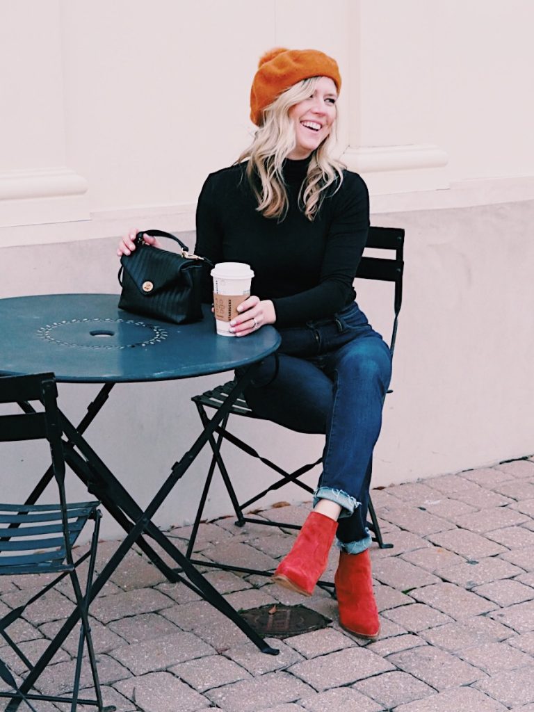 Emily from Emmy Lou Styles shares how she styles the Madewell beret from Nordstrom. | Orange Madewell beret styled by top US fashion blogger, Emmy Lou Styles: image of a woman wearing an orange beret from Madewell, Madewell turtleneck, Sole Society cross body bag, J Crew jeans, Sam Edelman red booties