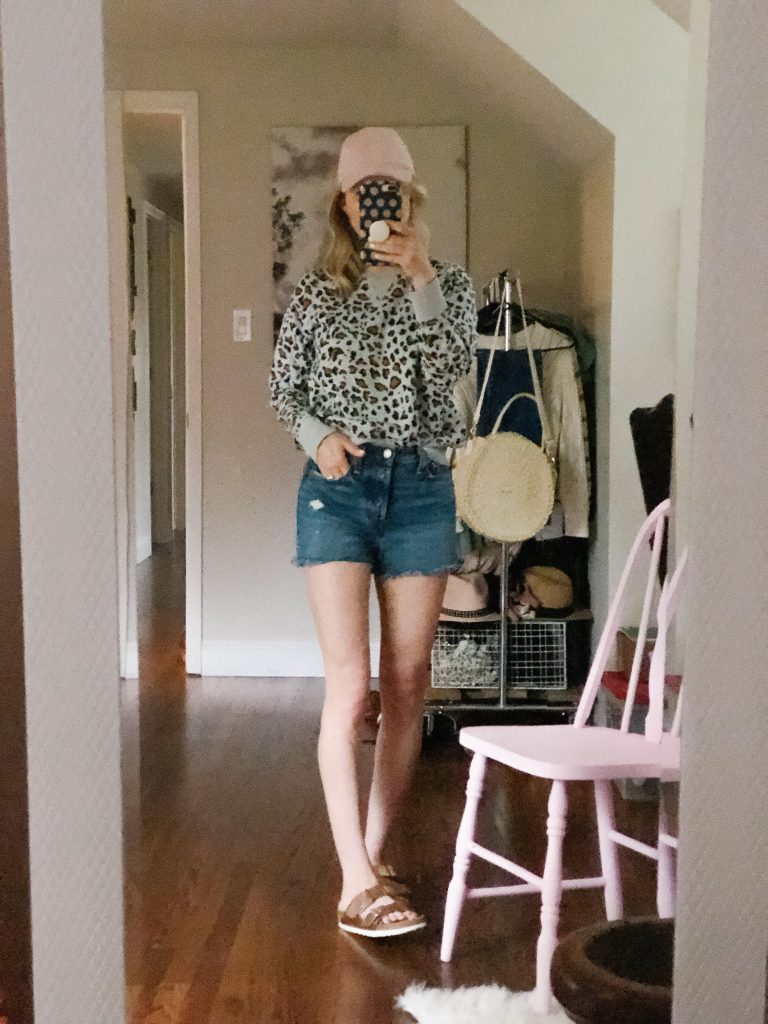 how to style denim shorts with a sweatshirt