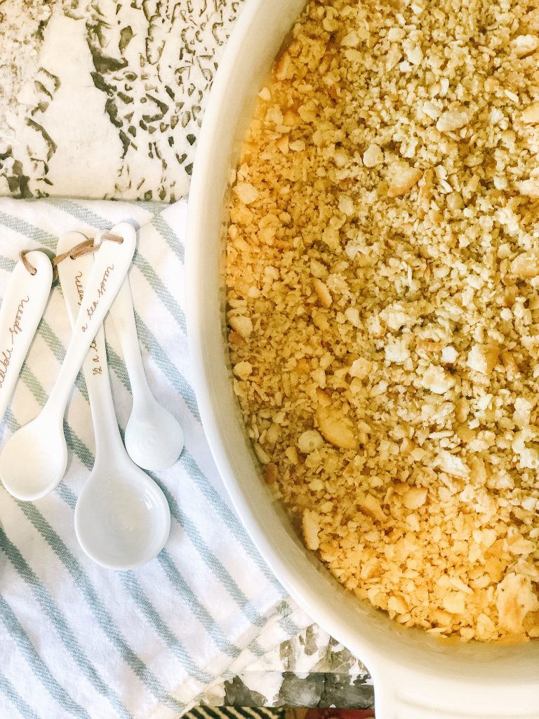 the perfect summer side dish_pineapple casserole; image of pineapple casserole with ceramic measuring spoons