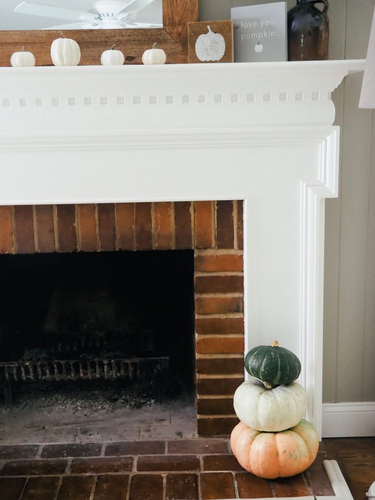 Fall mantle featuring colorful pumpkins from Trader Joes