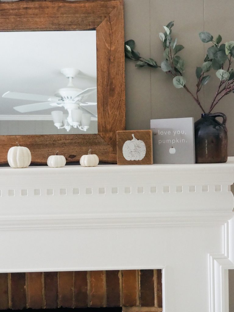 Simple fall mantle ideas featuring white pumpkins