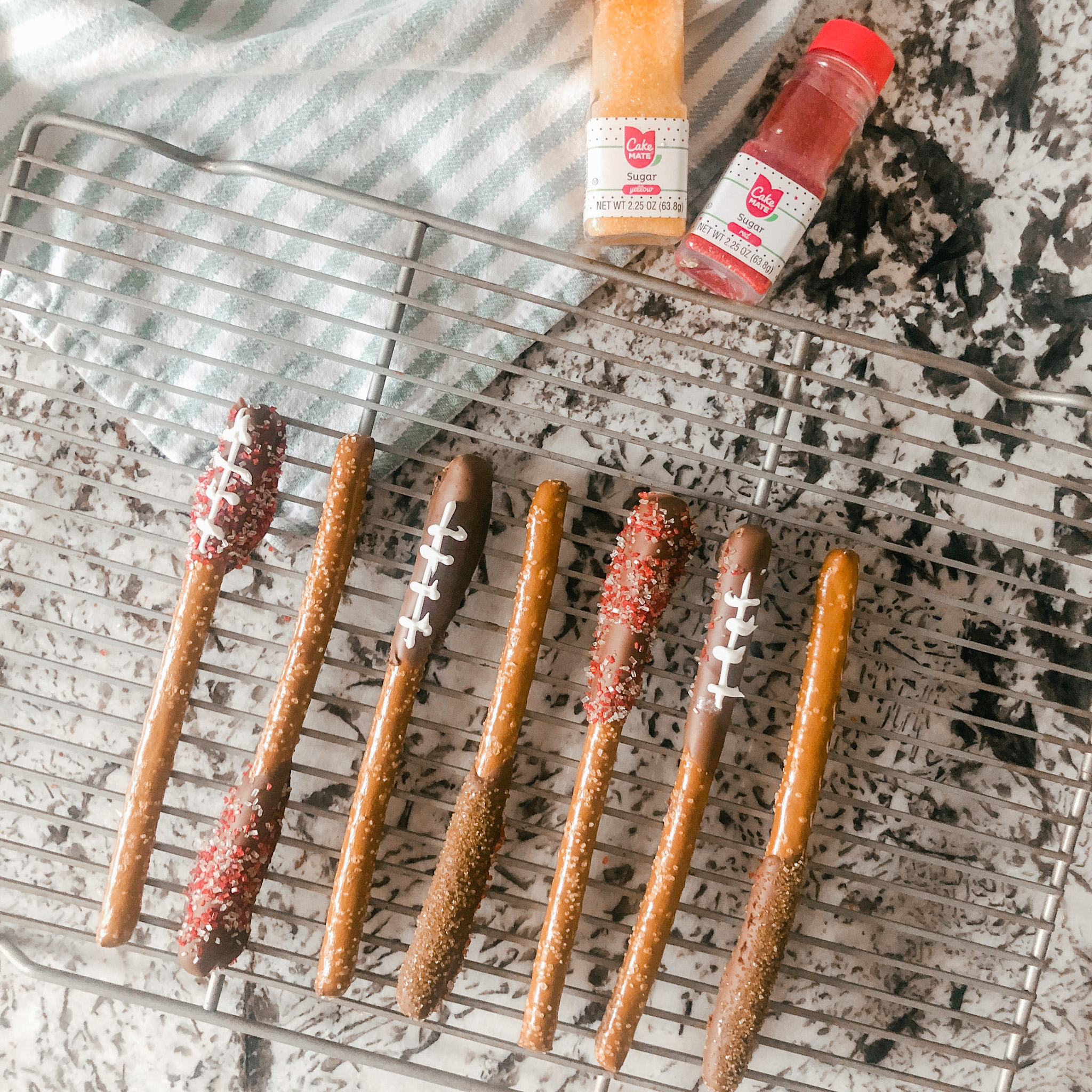 Chocolate covered pretzel rods with sprinkles